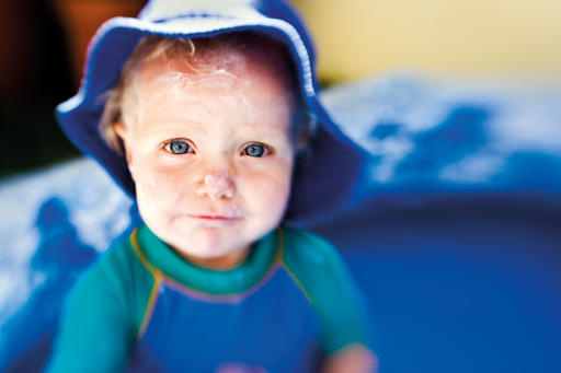 baby_suncream_face_beachhat.jpg