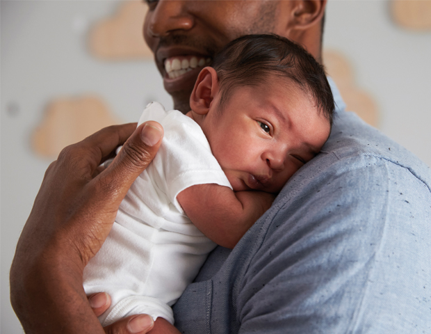 Tiny baby_cuddle dad_s.jpg