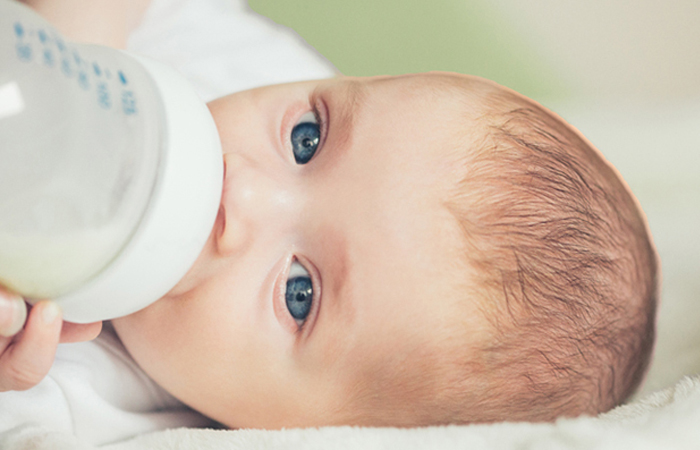 Baby drinking_milk bottle.jpg